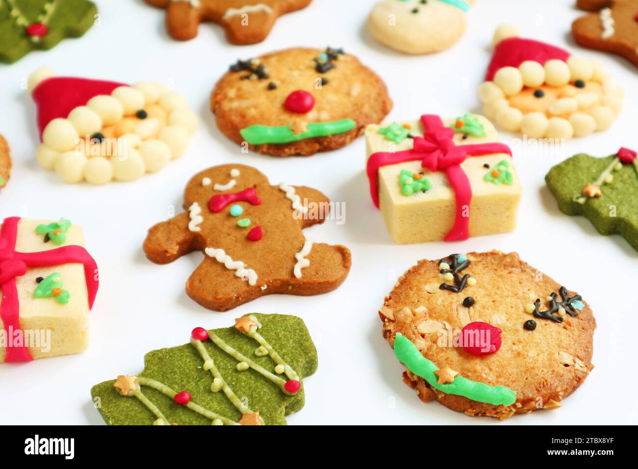 Assortment of Delectable Christmas Cookies Scattered on White Background Stock Photo