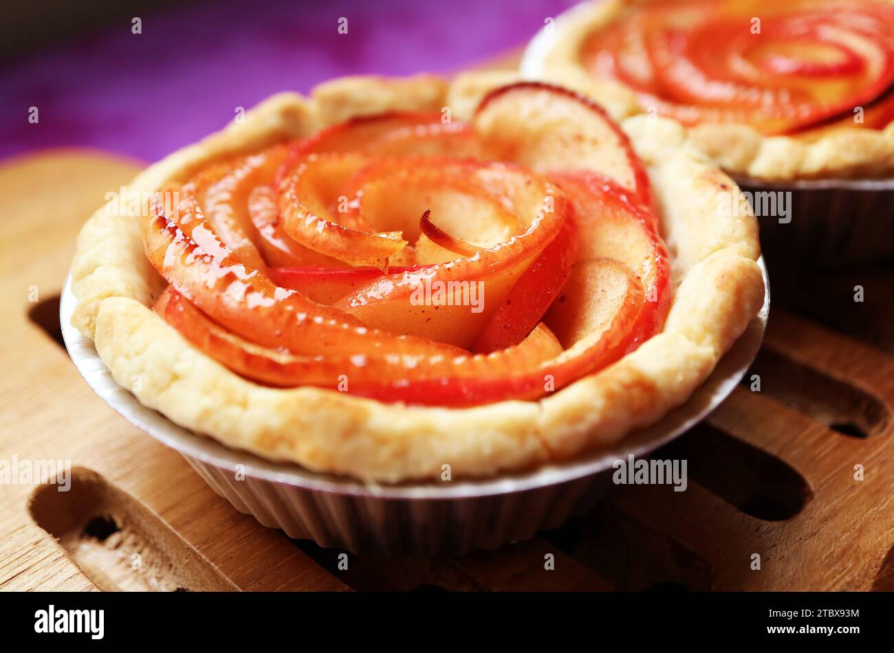 Closeup of a Delectable Freshly Baked Rose Shaped Apple Tartlet Stock Photo