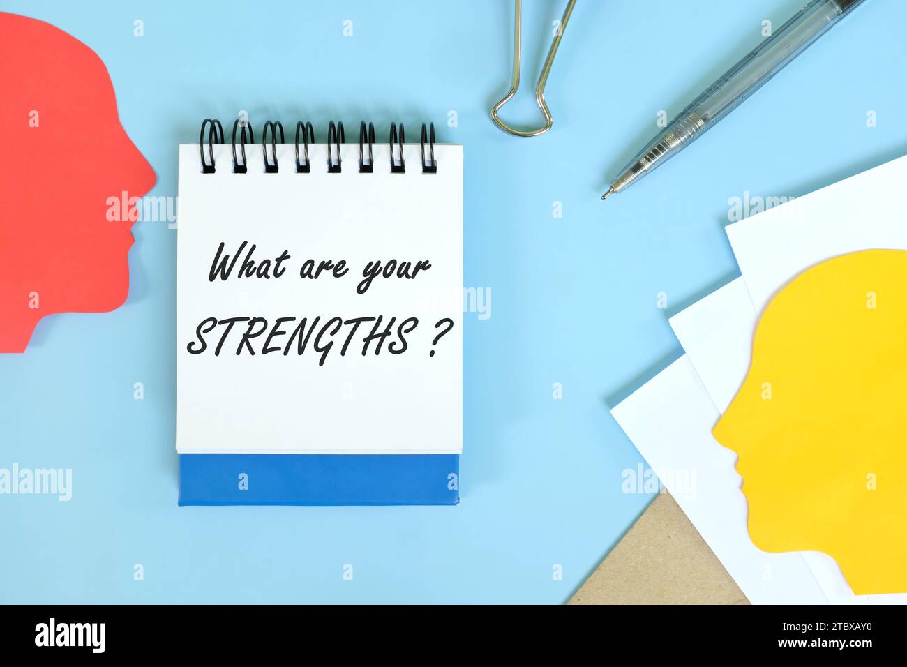 Self awareness and strengths personality concept. Office flat lay composition in blue background. Stock Photo