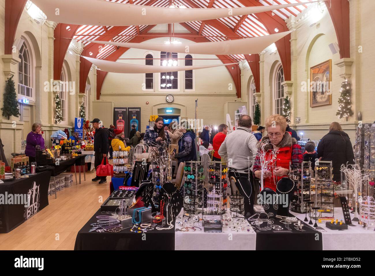 8th December 2023. The Hungerford Victorian Extravaganza, an annual Christmas event, took place in the West Berkshire town, England, UK. The evening features a parade, with Christmas street fair, festive music, food and drinks and steam engines. Pictured: Indoor craft market inside the town hall. Stock Photo