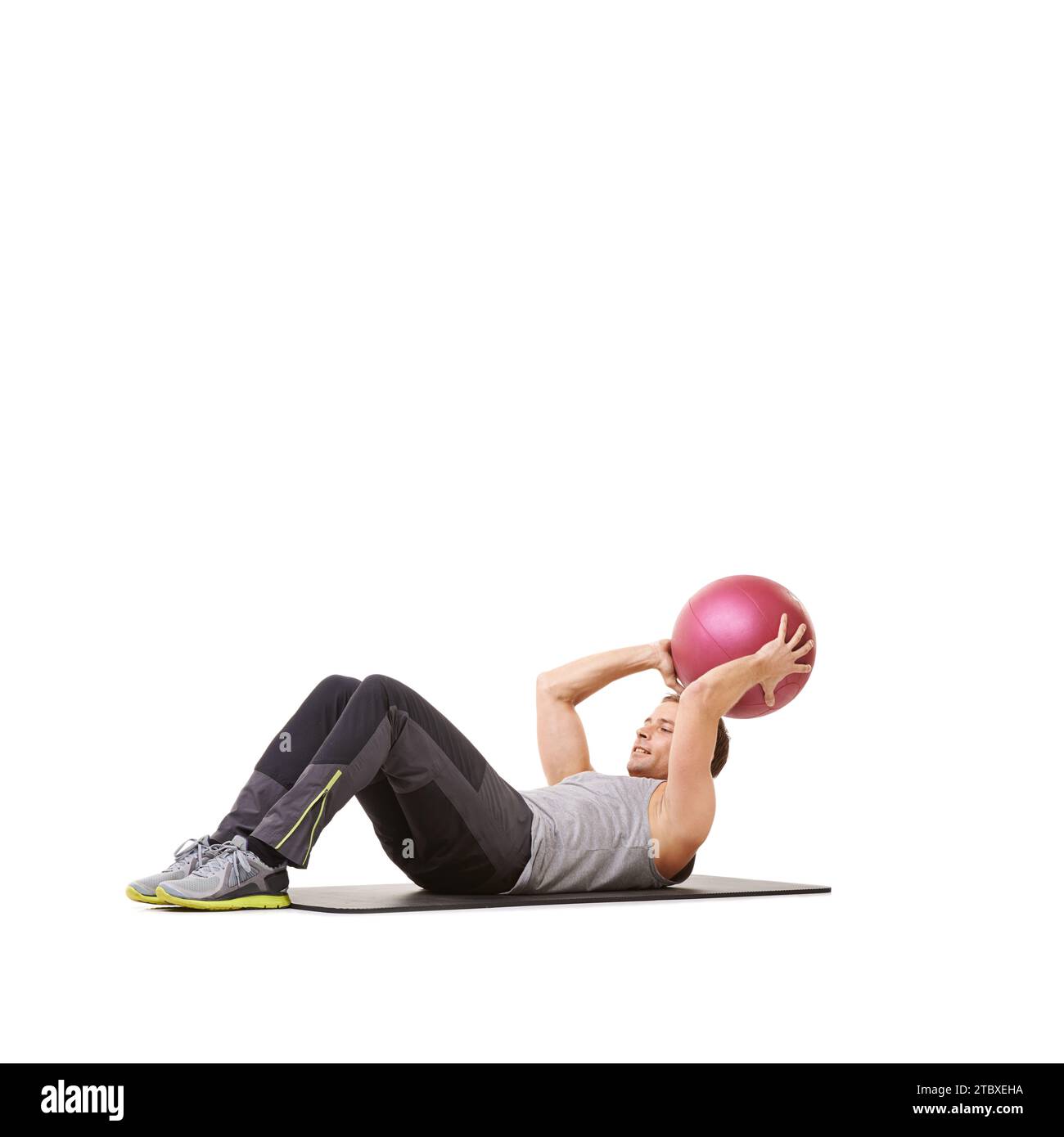 Man, medicine ball and sit up for workout fitness in studio on white