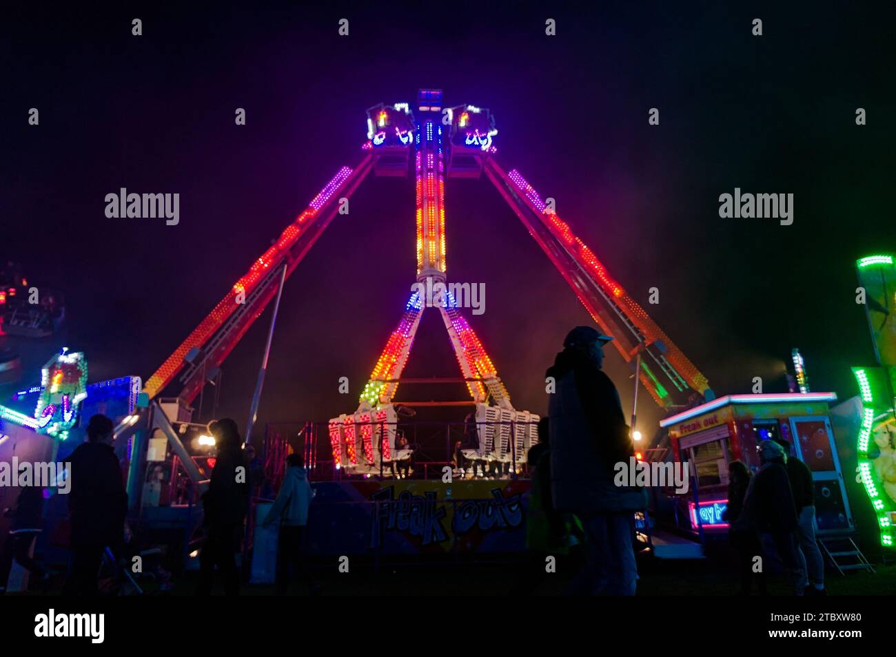 A colourful fair ride at the at Boston May fair in the evening Stock Photo
