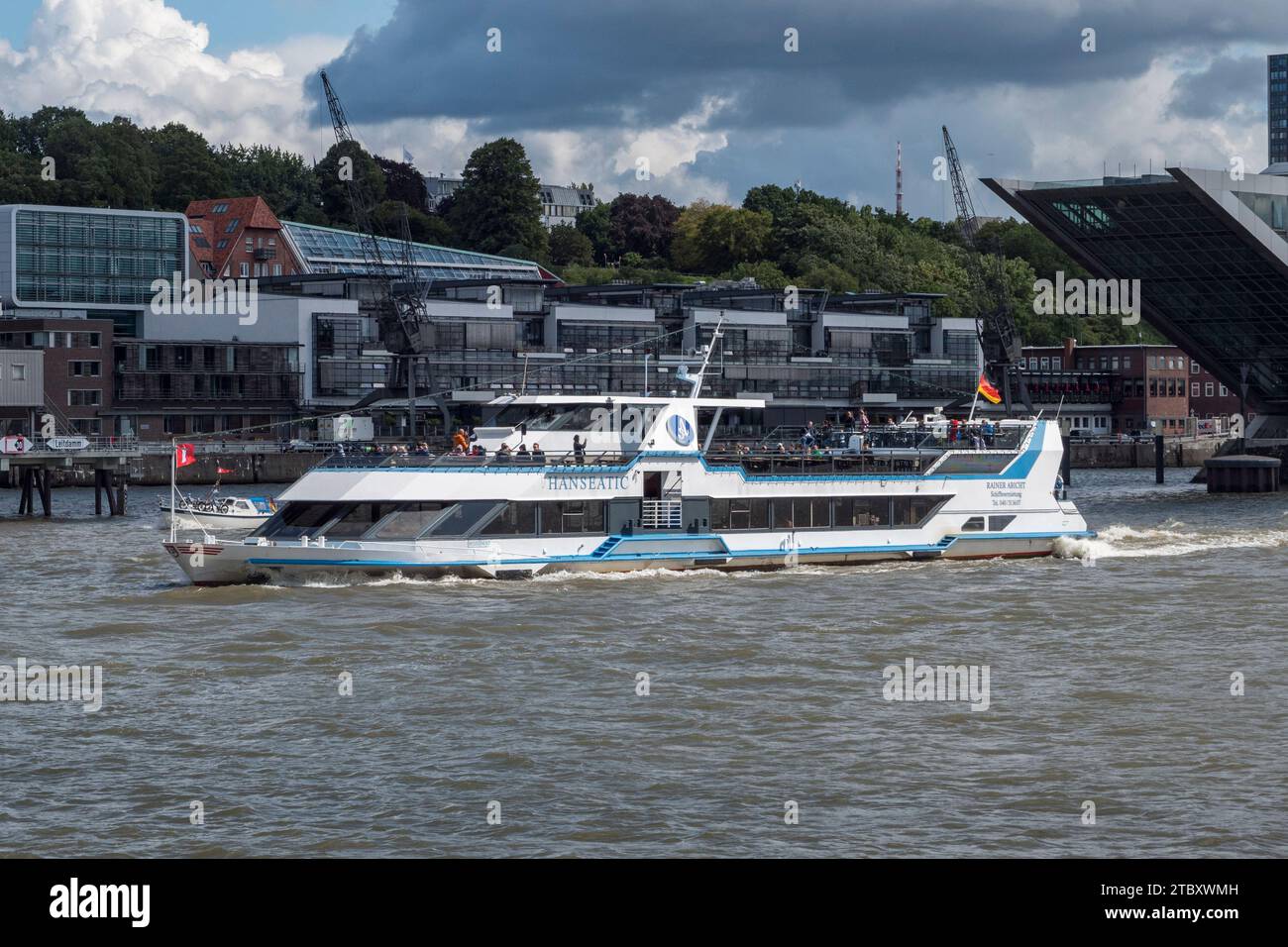 The MS Hanseatic guided tour boat on the River Elbe viewed from the 62 HADAG ferry in Hamburg, Germany. Stock Photo
