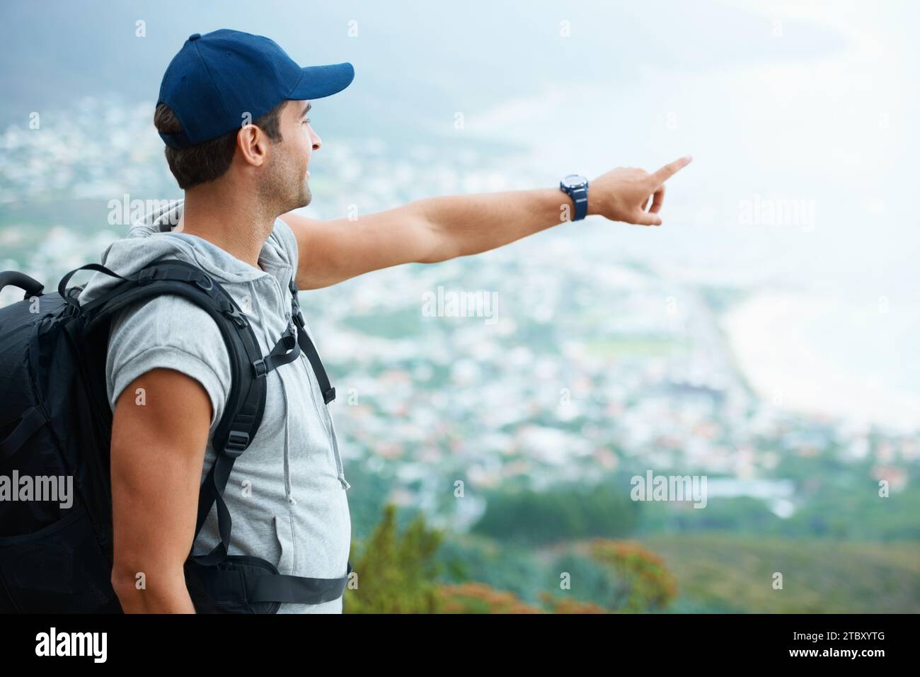 Outdoor, hiking and man with nature, pointing and adventure with ...