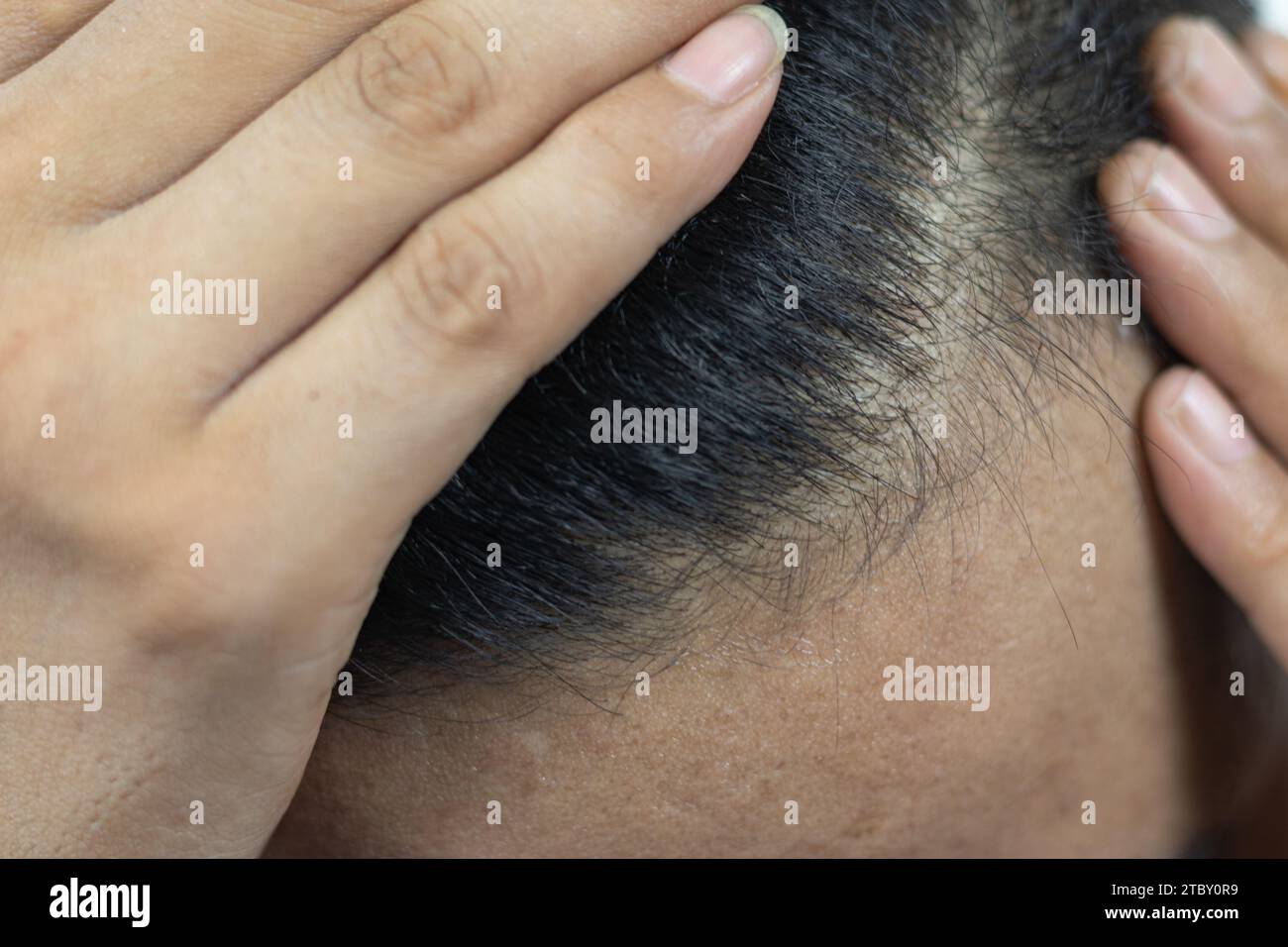 Close-up image of heat-damaged hair showing split ends and dryness