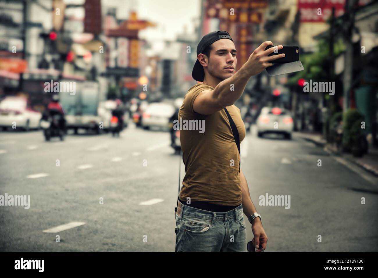 Man taking photo crowded street hi-res stock photography and images - Alamy