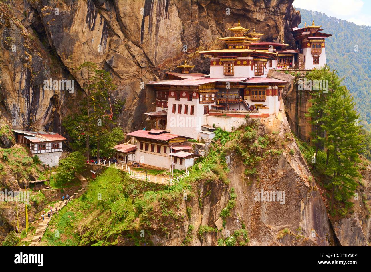 Paro Taktsang, the Tiger's Nest Monastery, a sacred Buddhist site built into the cliff face above the town of Paro in the kingdom of Bhutan. Stock Photo