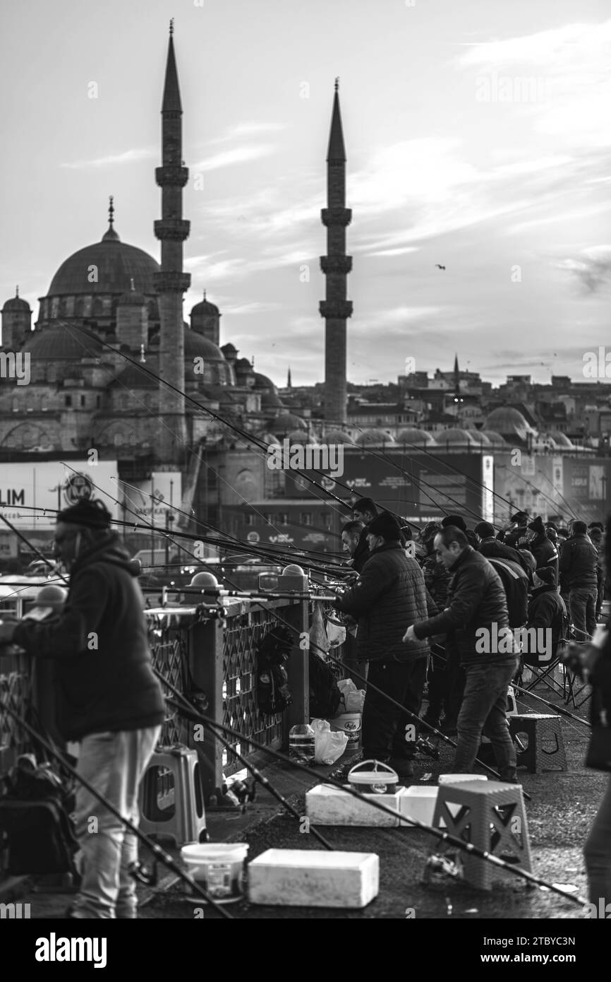 Istanbul, Turkiye NOV 22, 2021 People walking and fishing on Galata Bridge that connects