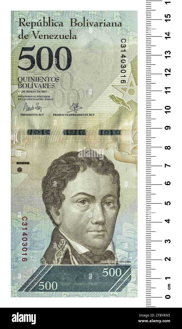 The front side of the Venezuelan banknote is two bolivars with a scaling ruler. Isolated on white Stock Photo