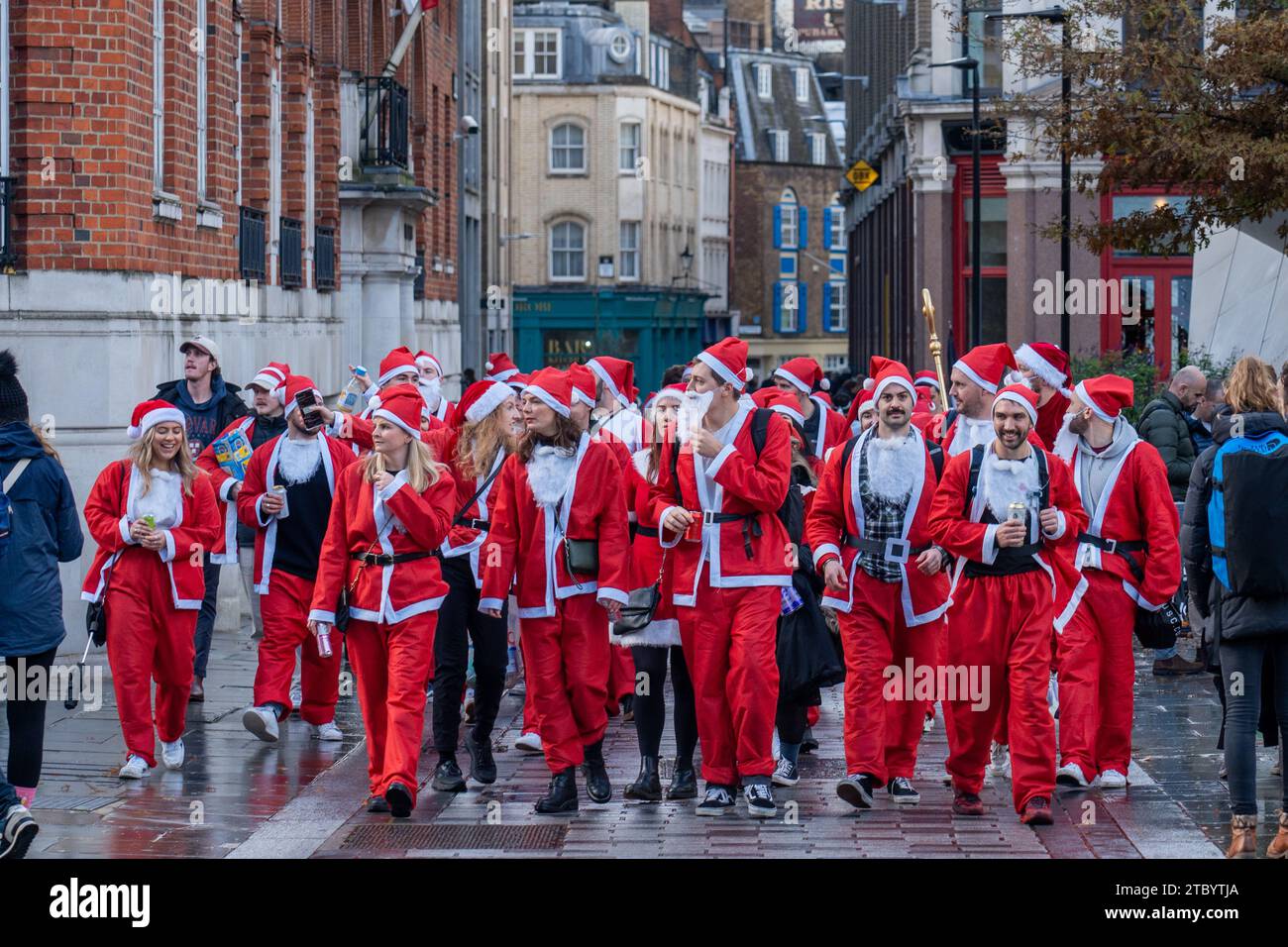 London, UK. Saturday, 9 December, 2023. A group of Santas in central London Photo: Richard Gray/Alamy Live News Stock Photo