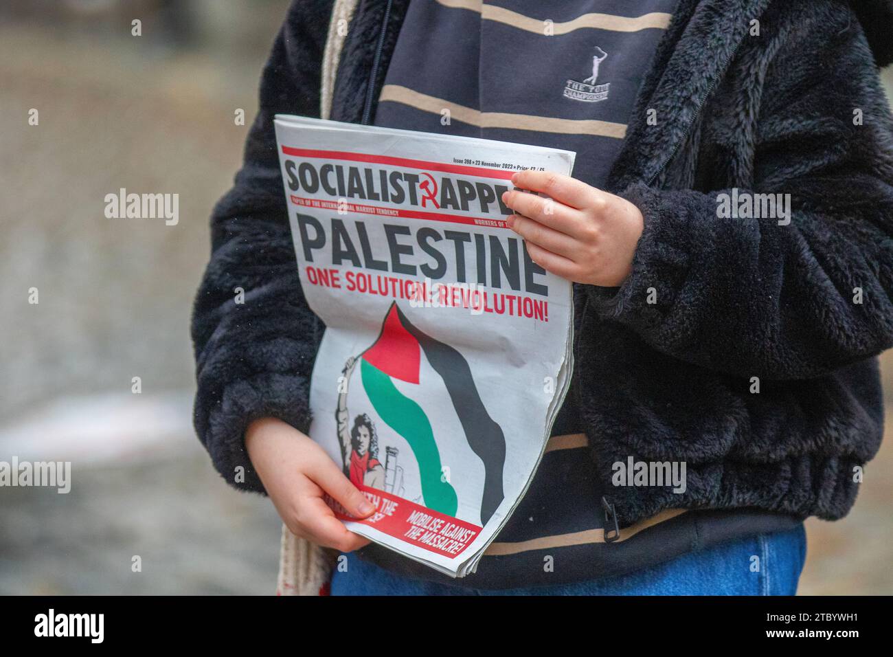 Socialist Appeal Preston, UK. 8 Dec 2023. Pro-Palestine forum posters. Socialist Appeal is the British section of the International Marxist Tendency. Join the Communists. Young women protesters with posters pamphlets & publications demonstrate against the Israel-Hamas war in the city centre. Credit: ZarkePix/Alamy Live News Stock Photo