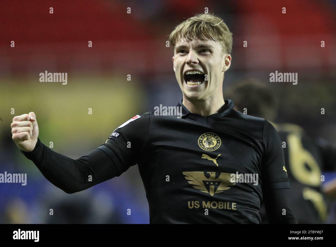 Luca Connell #48 of Barnsley punches the air after Barnsley win 1-3 during the Sky Bet League 1 match Reading vs Barnsley at Select Car Leasing Stadium, Reading, United Kingdom, 9th December 2023  (Photo by Alfie Cosgrove/News Images) Stock Photo