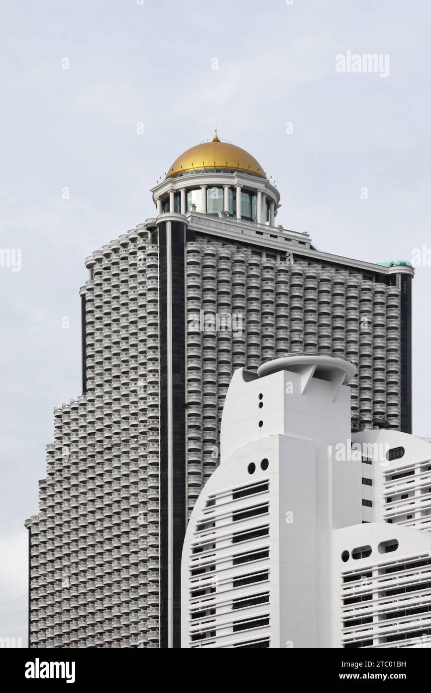 The State Tower is a skyscraper located on Silom Road in Bangkok. There is a forty-story high atrium inside, and on the 64th floor is the world's high Stock Photo