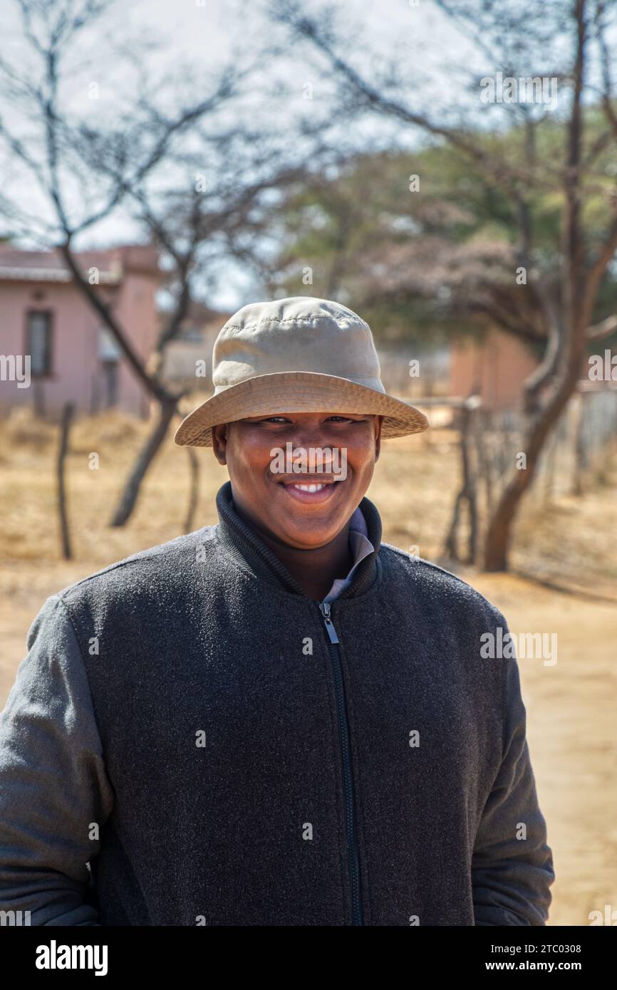 portrait of happy overweight village young man , Botswana rural area ...