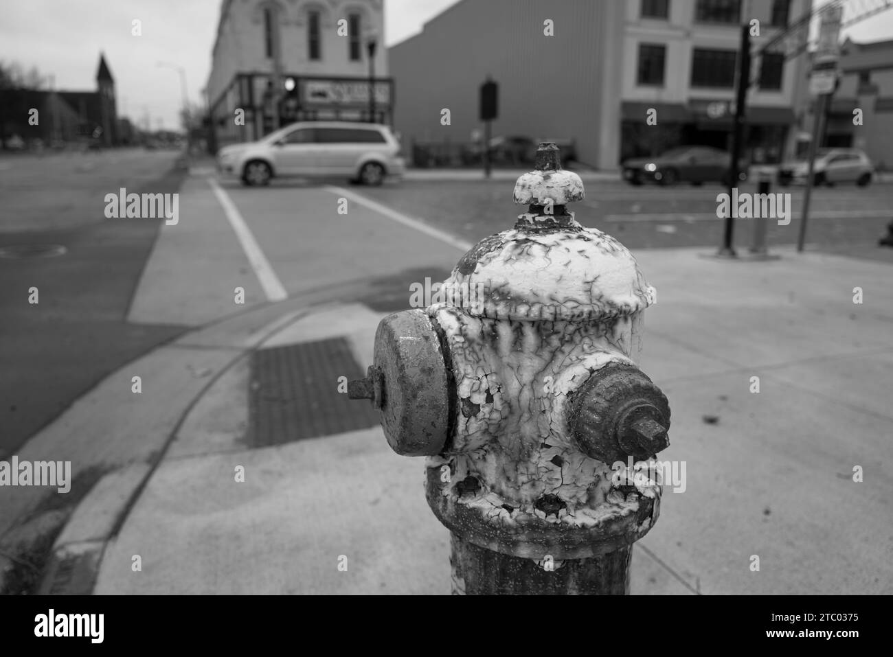 Fire hydrant, with very worn and textured paint, in Flint Michigan USA Stock Photo