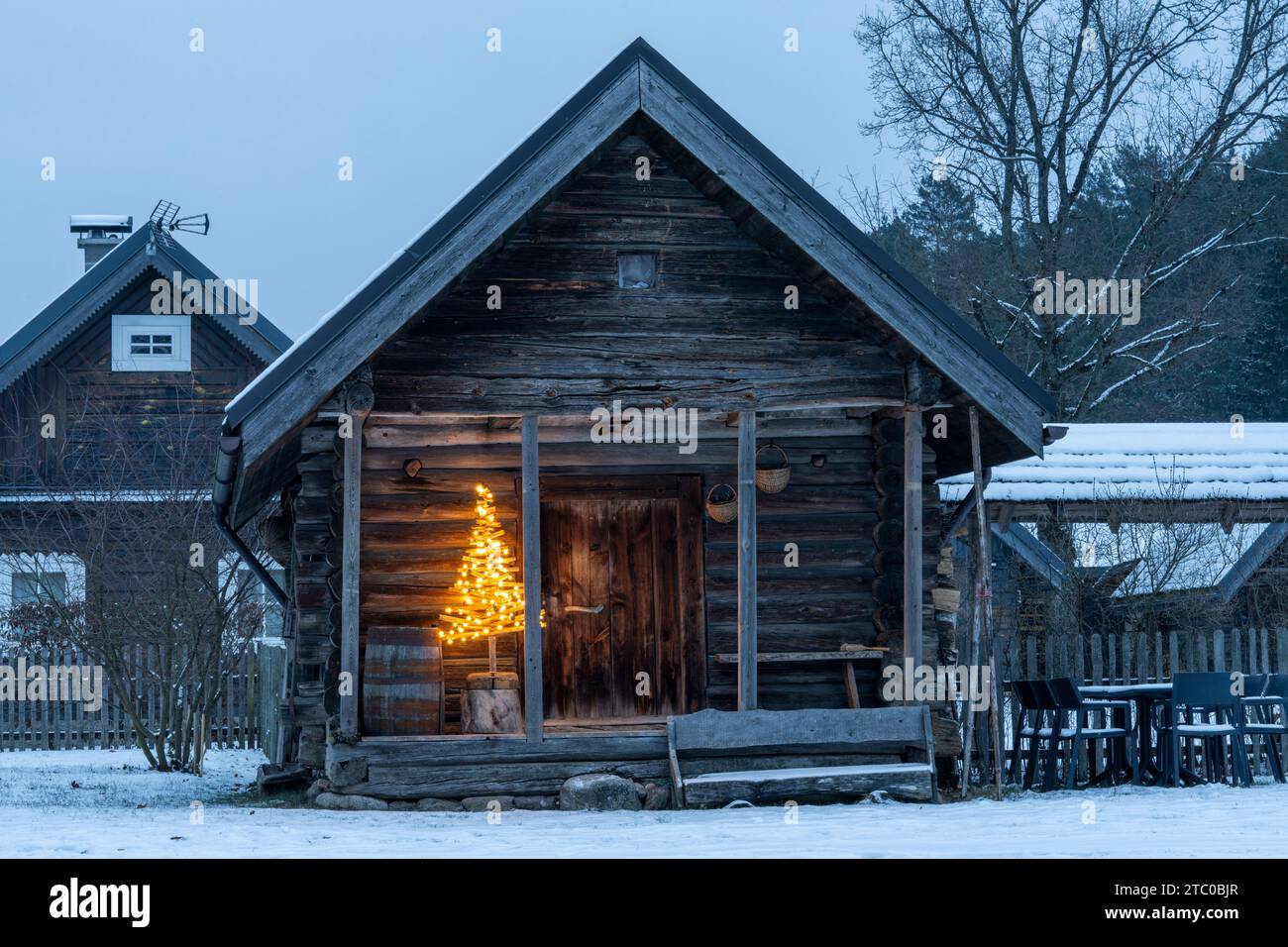 Christmas tree near old house in Lithuanian village Stock Photo