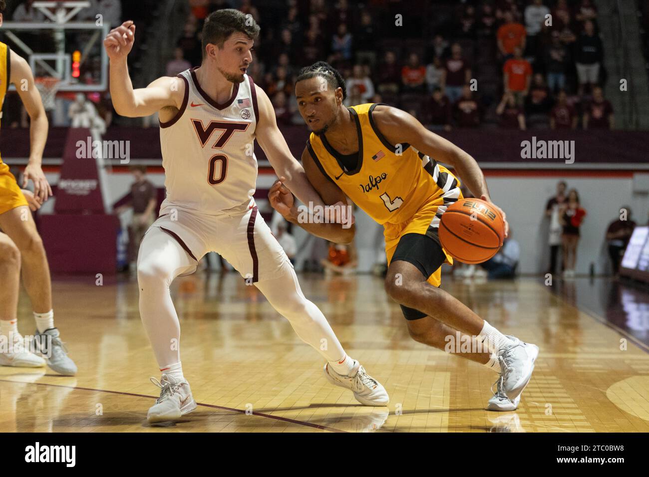 Blacksburg, VA, USA. 9th Dec, 2023. Valparaiso Beacons guard Sherman Weatherspoon IV (4) is guarded closely by Virginia Tech Hokies guard Hunter Cattoor (0) during the NCAA basketball game between the Valparaiso Beacons and the Virginia Hokies at Cassell Coliseum in Blacksburg, VA. Jonathan Huff/CSM/Alamy Live News Stock Photo