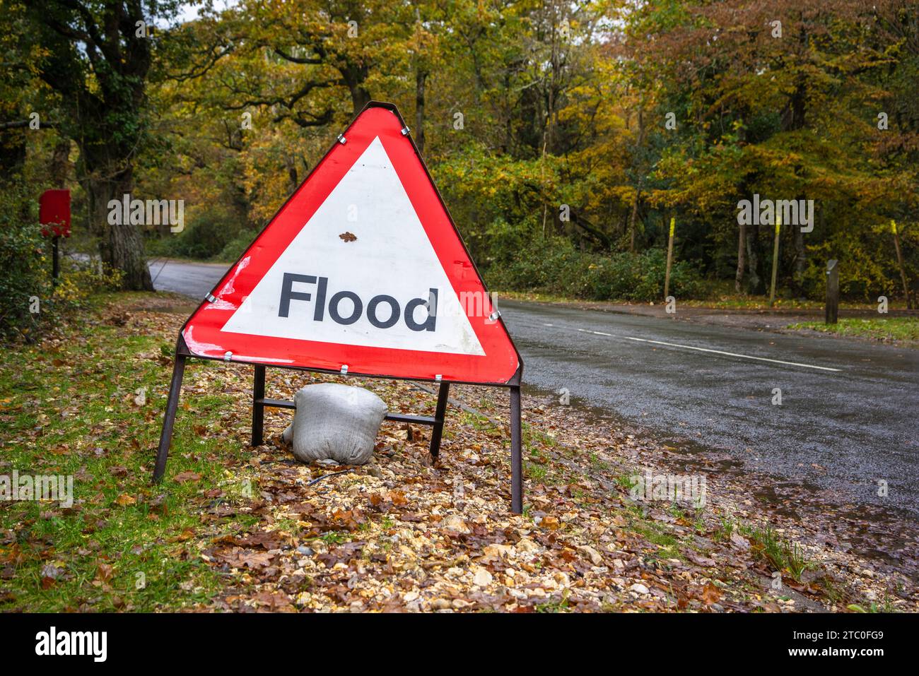 Red Flooding / Floods warning sign during autumn floods in Southern England, UK Stock Photo