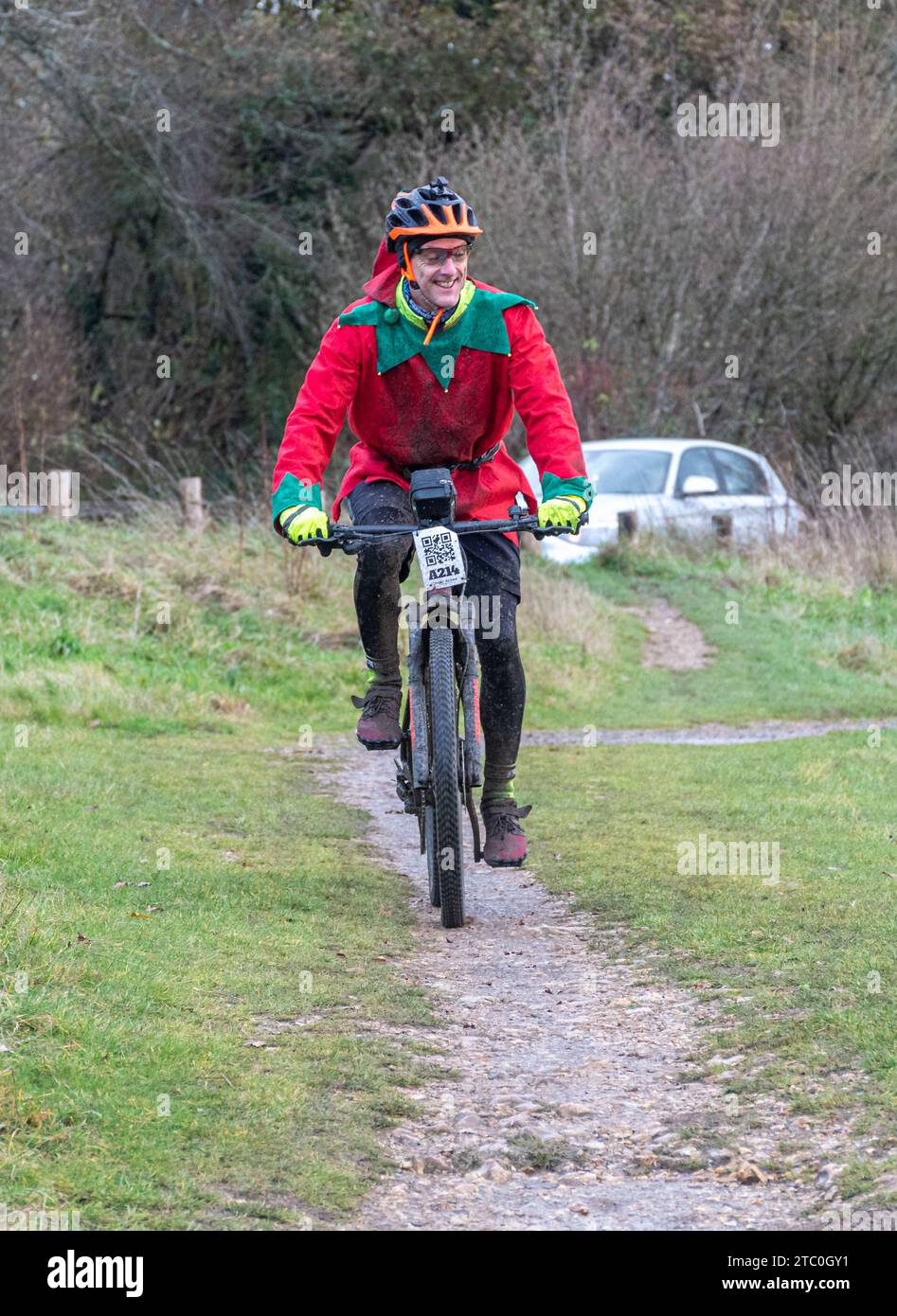 9th December 2023. Competitors riding their mountain bikes in the Dirty Santa MTB trail cycling event in the Surrey Hills, England, UK. Many of the cyclists were in Christmas themed fancy dress costumes, and were getting very muddy on the off-road route through the Surrey Hills Area of Outstanding Natural Beauty. Stock Photo
