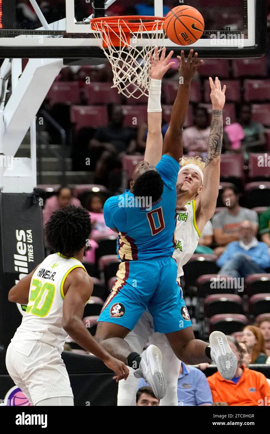 Florida State guard Chandler Jackson (0) shoots as South Florida