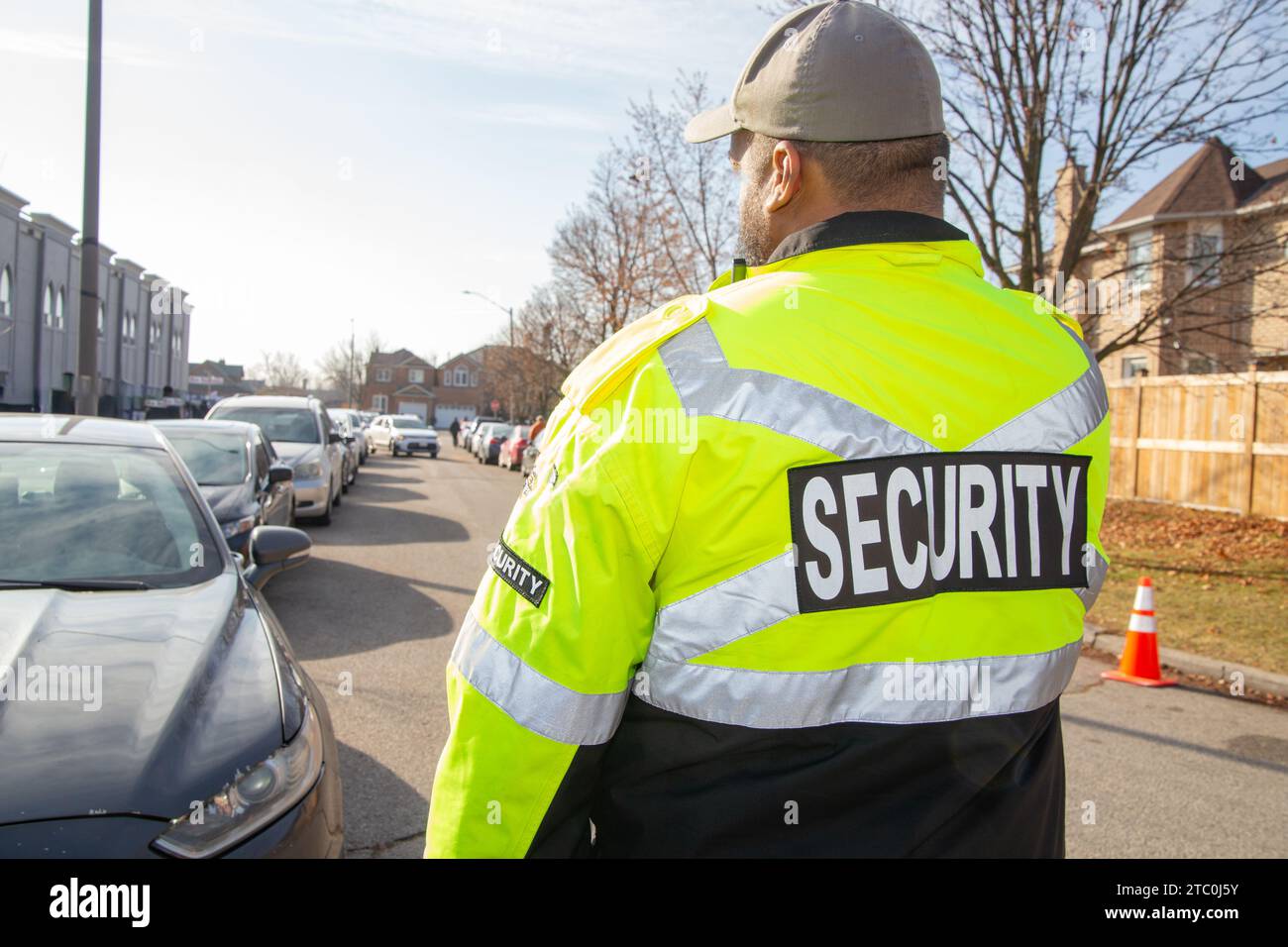 Security guard conducting access control and traffic control around a