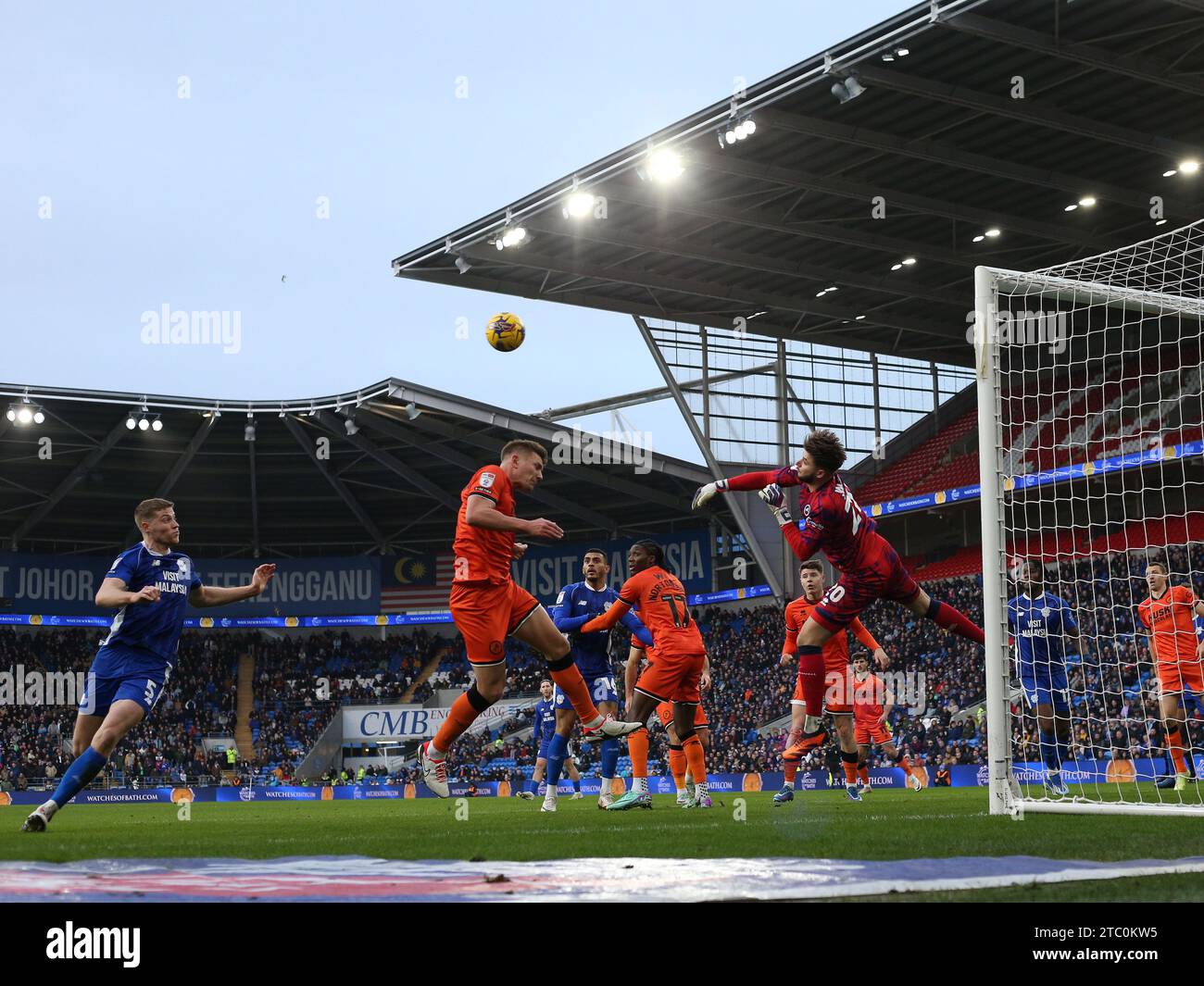 Cardiff, UK. 09th Dec, 2023. Matija Sarkic, the goalkeeper of Millwall punches clear to make a save in the 1st half. EFL Skybet championship match, Cardiff city v Millwall at the Cardiff City Stadium in Cardiff, Wales on Saturday 9th December 2023. this image may only be used for Editorial purposes. Editorial use only, pic by Andrew Orchard/Andrew Orchard sports photography/Alamy Live news Credit: Andrew Orchard sports photography/Alamy Live News Stock Photo