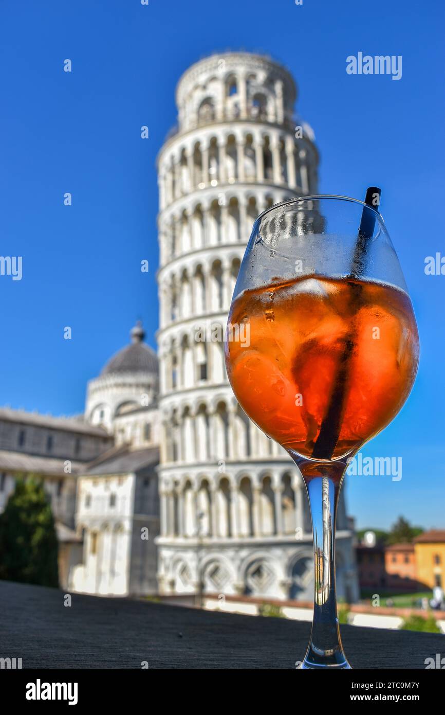 Spritz Cocktail in goblet glass with background landscape with leaning tower of Pisa, Itay on blue sky Stock Photo