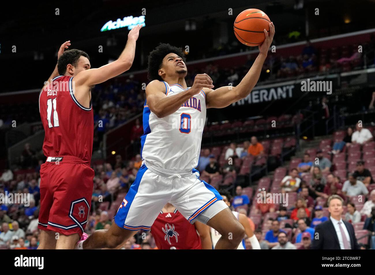 Florida guard Zyon Pullin (0) goes to the basket as Richmond guard