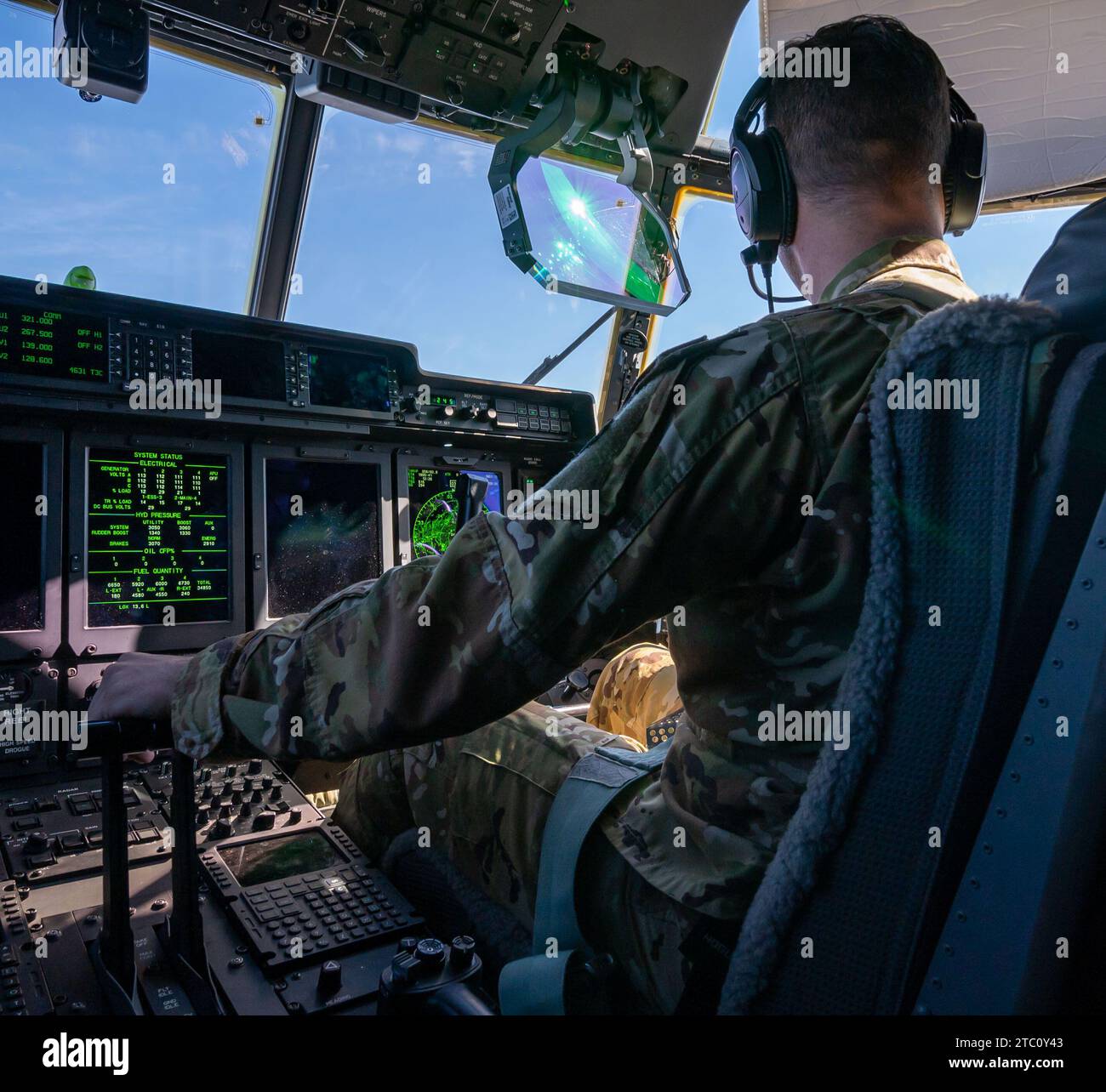 A 39th Rescue Squadron pilot, 1st Lt. Derek Polkamp, flies a 920th Rescue Wing HC-130J Combat King II aircraft toward a rendezvous location to conduct tilt-rotor air-to-air refueling with U.S. Marine Corps MV-22B Osprey aircraft assigned to Marine Medium Tiltrotor Squadron (VMM) 164 over California during Exercise Distant Fury Stallion 23 on Dec. 6, 2023. This joint exercise, in conjunction with Exercise Steel Knight 23.2, presented a uniquely suited opportunity in remote, austere conditions to validate the wing’s interoperability within the joint team while reaffirming the wing’s lethality, p Stock Photo