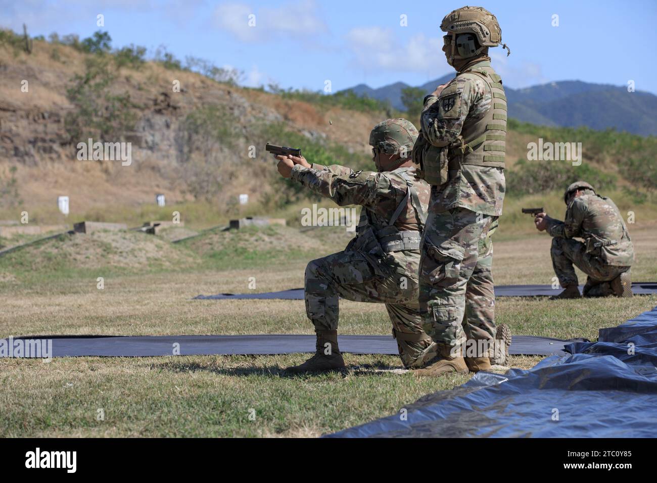 Soldiers assigned to the 101st Troop Command Army National guard, fire the M17 pistol during qualification at Camp Santiago Training  Center, Salinas, Puerto Rico, Dec. 9, 2023. Soldiers qualify on various weapons systems to maintain readiness and hone their skills as members of the armed forces. (U.S. Army National Guard photo by Spc. Felix Ortiz Rivera) Stock Photo