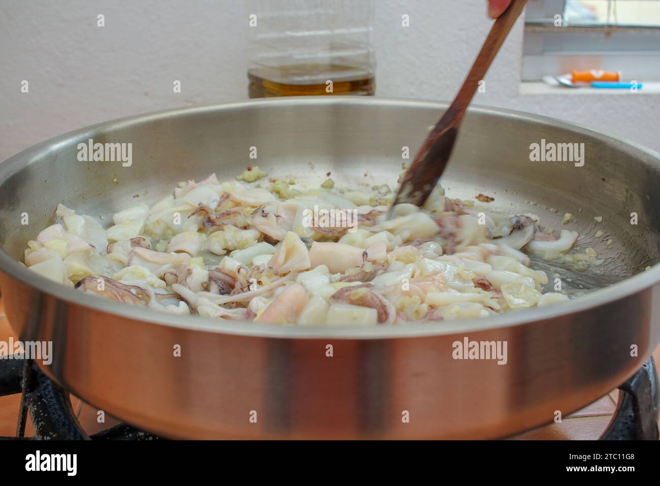 Gourmet Delight: Handcrafted Squid Ink Paella in the Making Stock Photo