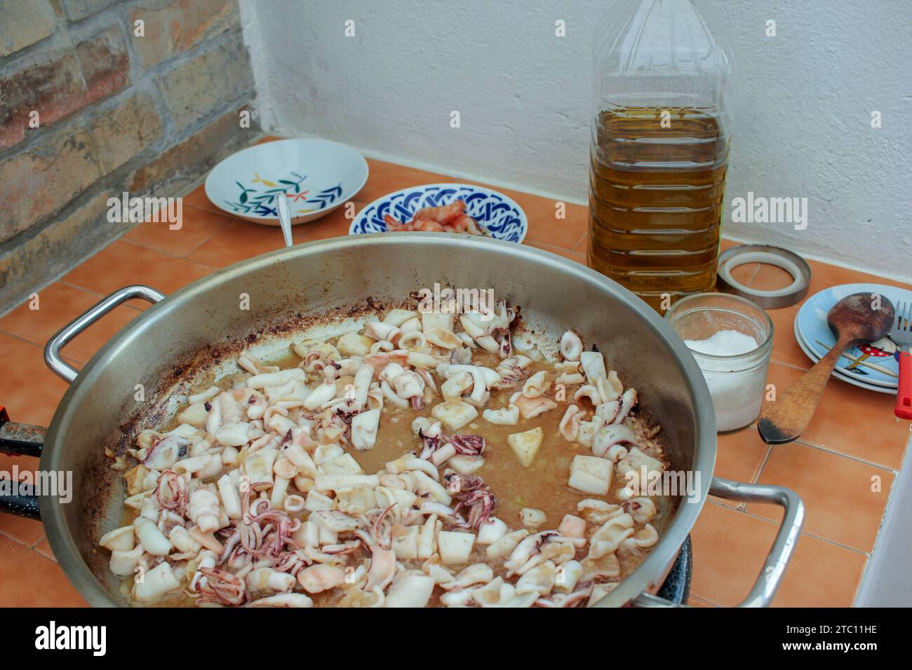 Gourmet Delight: Handcrafted Squid Ink Paella in the Making Stock Photo