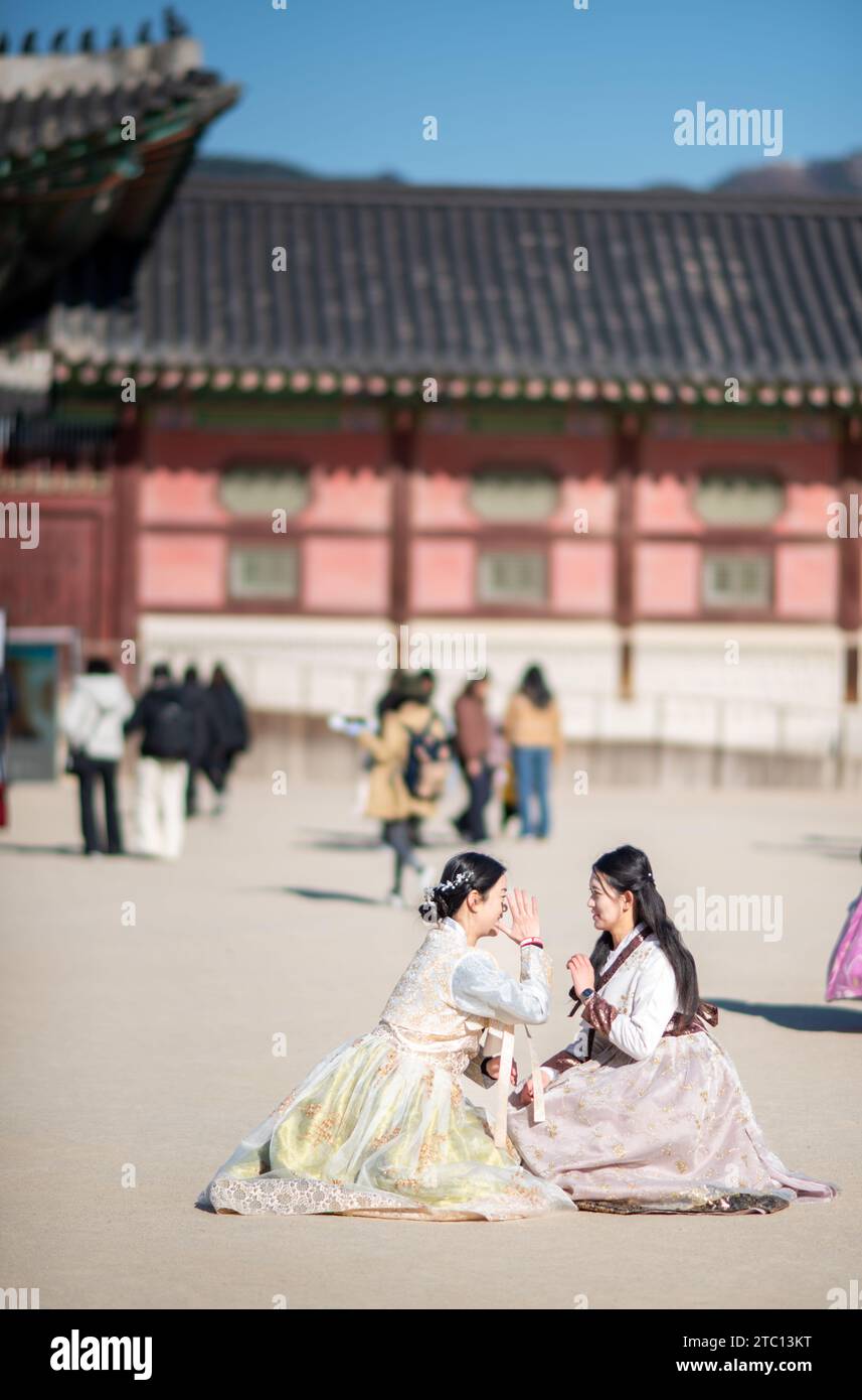 Tourists wearing traditional Korean Hanbok dresses in Seoul capital of South Korea on 25 November 2023 Stock Photo