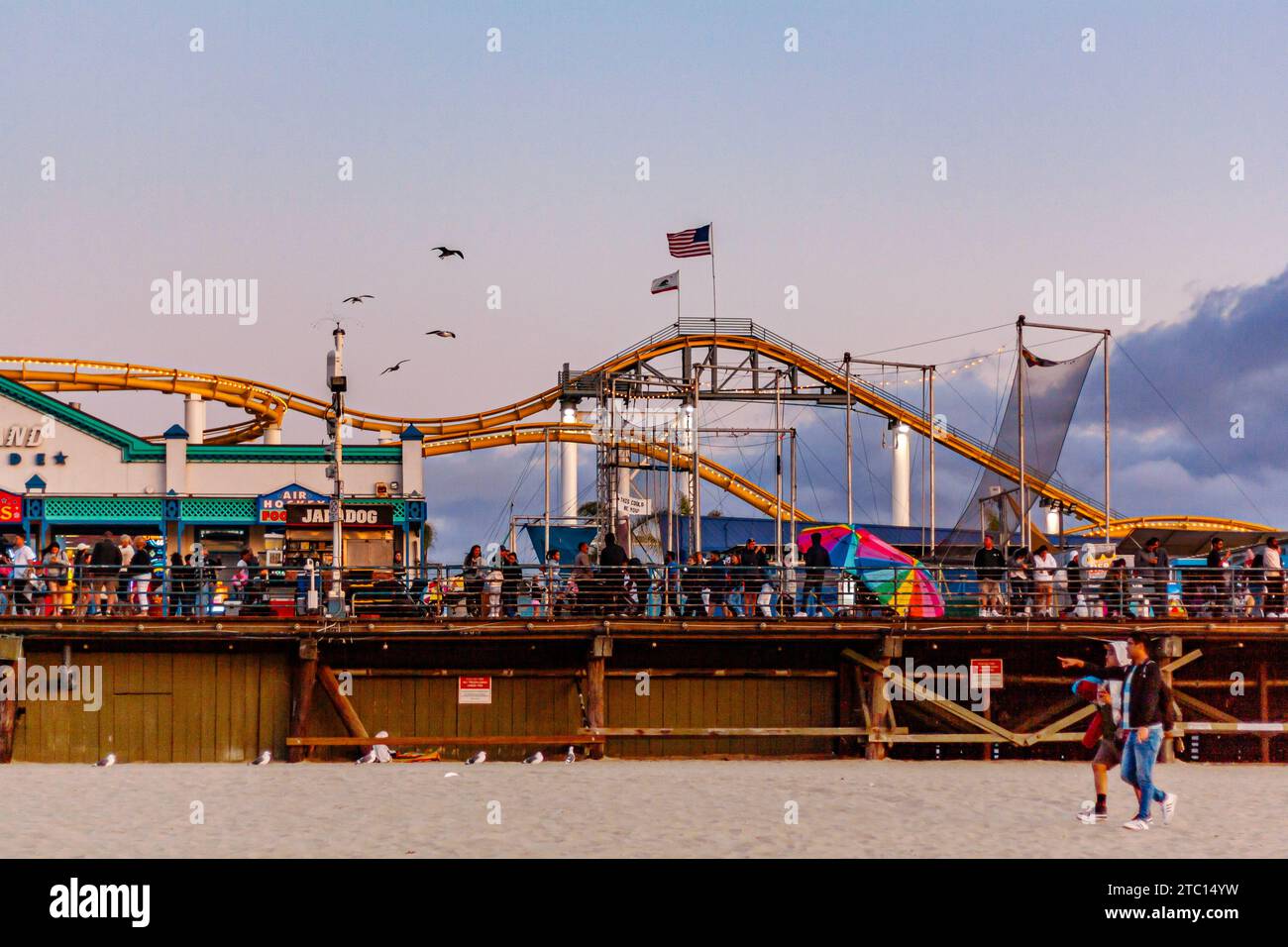 The roller coaster at Pacific Park amusement park on Santa Monica Pier, Santa Monica, California, at sunset in the summer Stock Photo