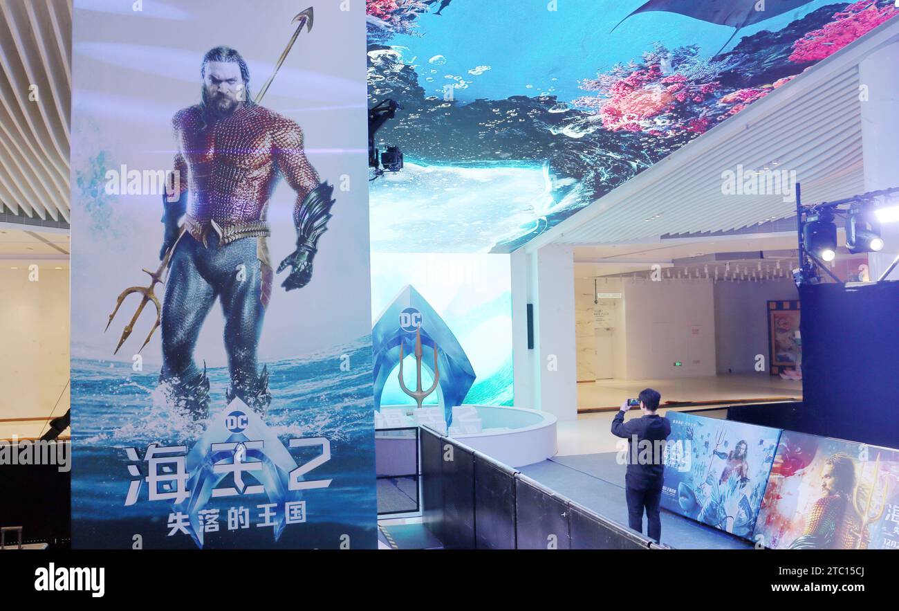 Shanghai, China. 09th Dec, 2023. Fans are standing in front of a poster of the film 'Aquaman and The Lost Kingdom' at a cinema in Shanghai, China, on December 9, 2023. (Photo by Costfoto/NurPhoto) Credit: NurPhoto SRL/Alamy Live News Stock Photo