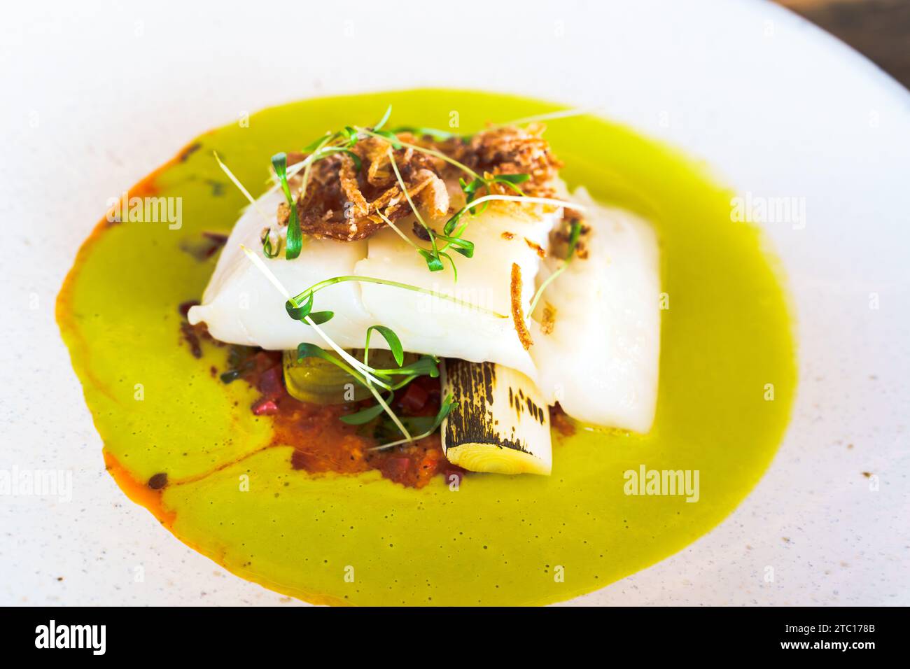 Delicious Cooked Fish Fillet Served On A White Plate In A Fine Dining 