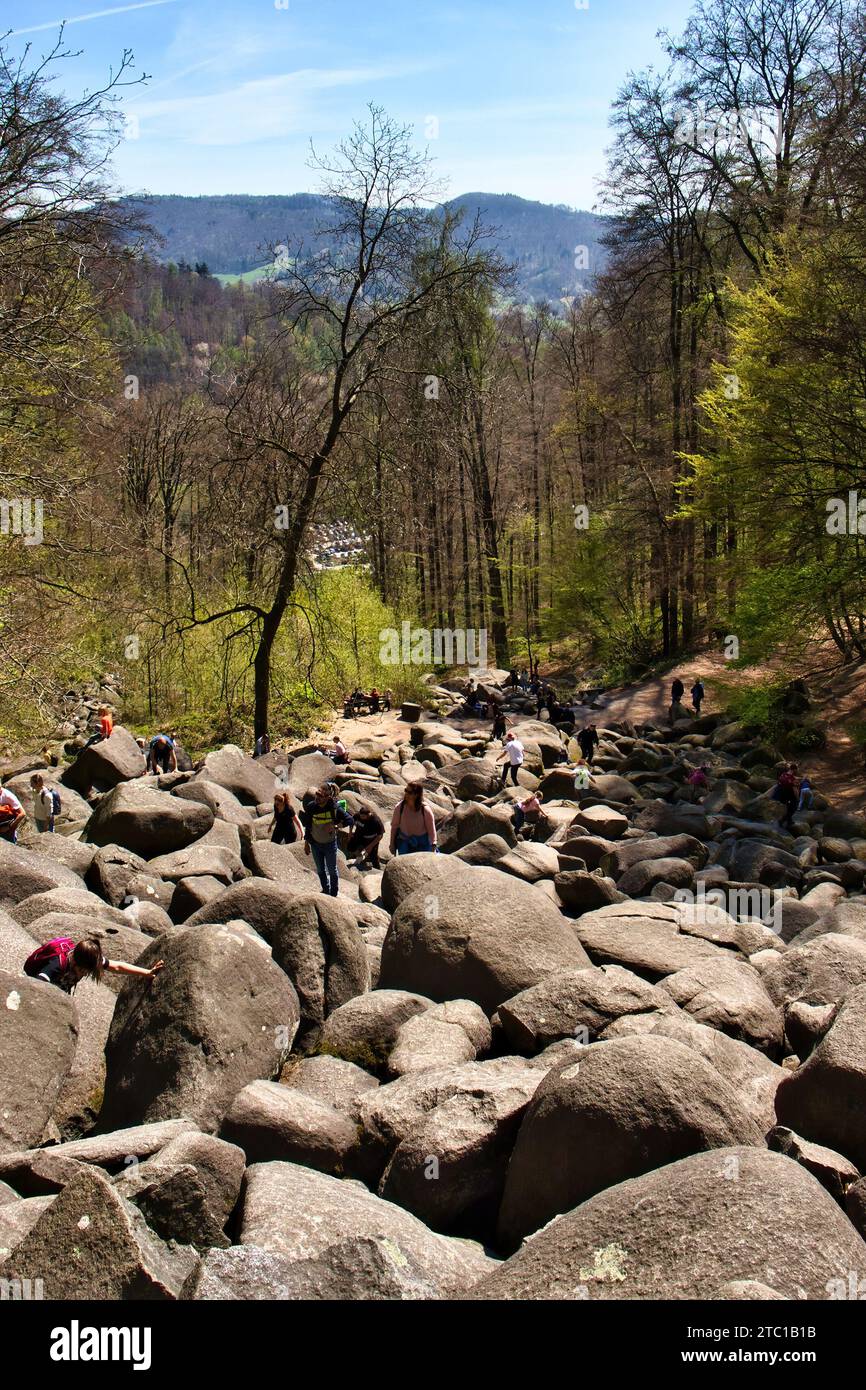 Lautertal, Germany - April 24, 2021: Looking down on rocks between trees on a hill at Felsenmeer on a spring day in Germany. Stock Photo