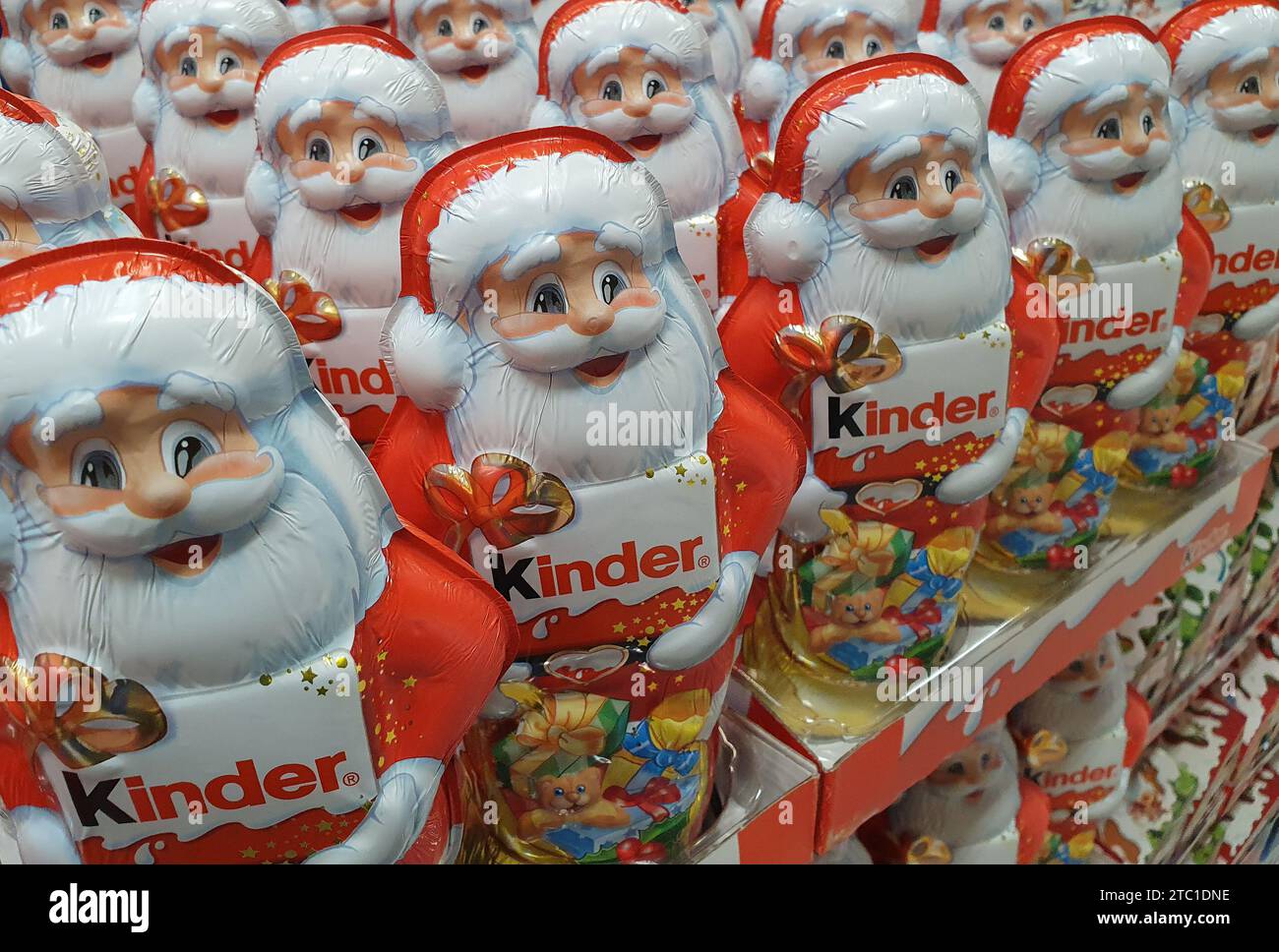 A display of festive Kinder Santa Claus figurines prominently arranged