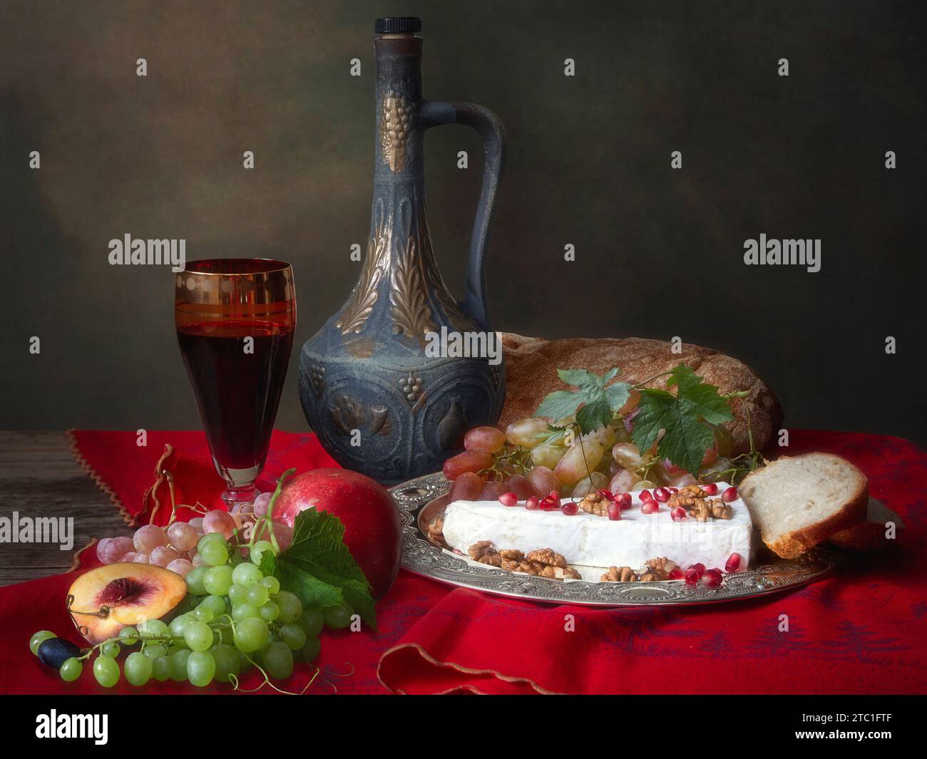 Still life with red wine, fruits and cheese Stock Photo - Alamy