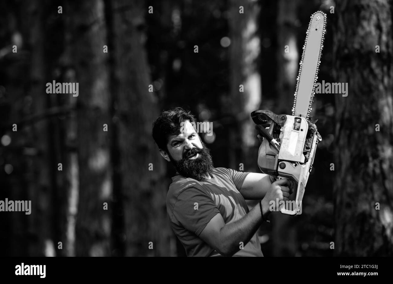 Man doing mans job. Agriculture and forestry theme. Handsome young man