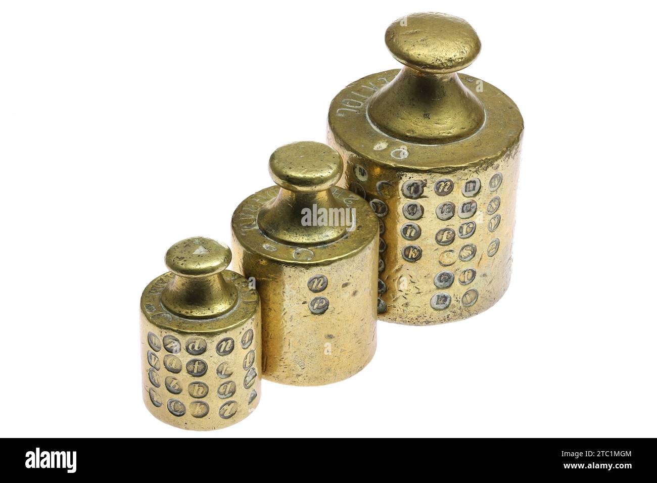 vintage brass weights with several calibration hallmarks isolated on