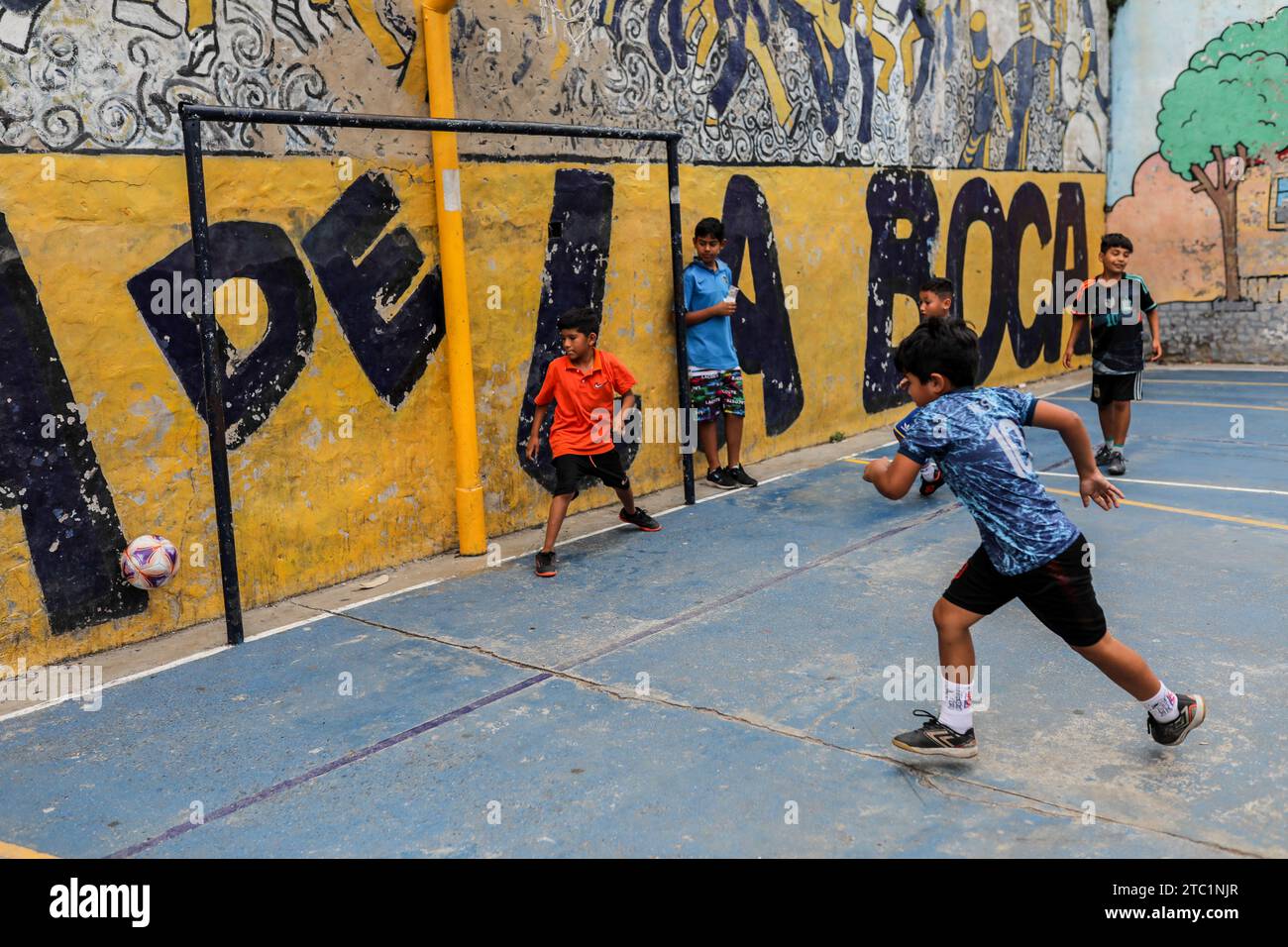 Children seen playing along the 'La Boca' neighborhood, before the change of government amid economic and social upheaval. President-elect Javier Milei of La Libertad Avanza, a far-right libertarian who burst onto the Argentine political scene with eccentric and radical proposals, will take office on Sunday, December 10, replacing incumbent Peronist Alberto Fernández. Milei describes himself as an 'anarcho-capitalist' libertarian who wants to drastically reduce the size of the state and replace the local peso with the US dollar. The new administration will face the challenge of reducing the co Stock Photo