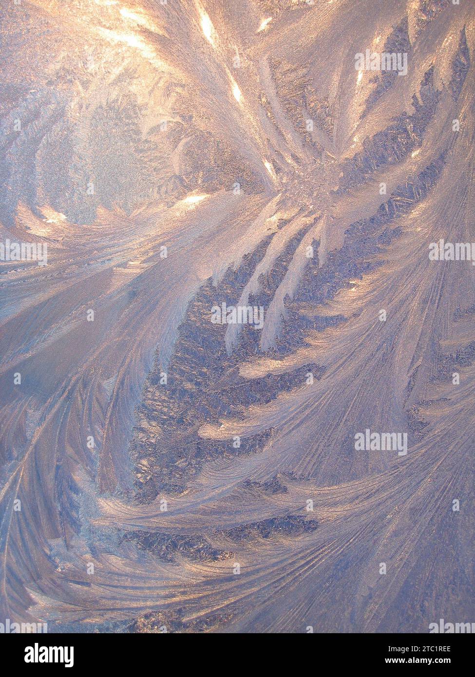 Frosty natural pattern and sunlight on winter window Stock Photo - Alamy