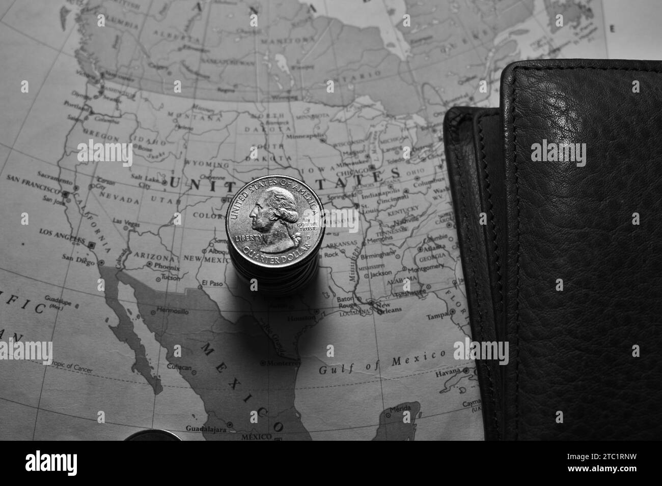 US Quarter dollar is stacked under United States geographical map with