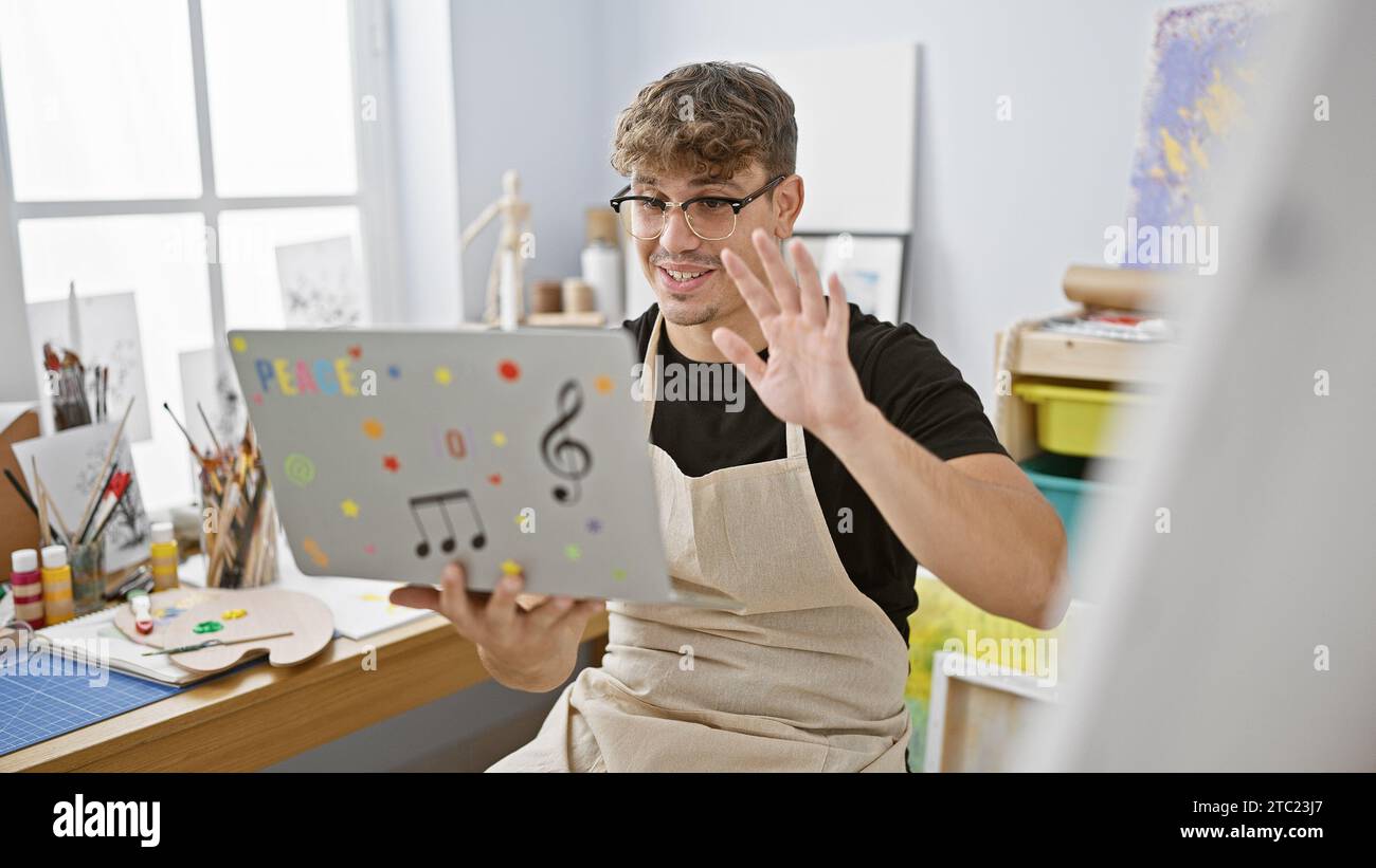 Enthusiastic young hispanic artist giving thumbsup gesture during an