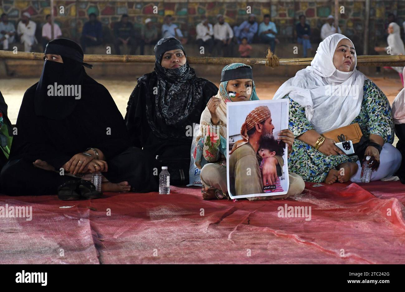 Mumbai, India. 09th Dec, 2023. A Muslim girl holds a placard during the demonstration. More than thousand Muslim men, women and children gathered to show their solidarity with Palestine in a silent protest, they held placards and sat on the ground without shouting any slogans. Credit: SOPA Images Limited/Alamy Live News Stock Photo