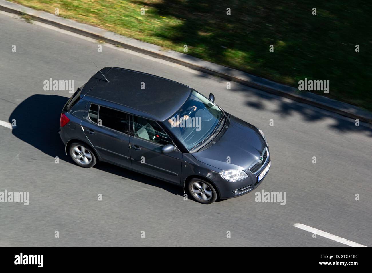 OSTRAVA, CZECH REPUBLIC - AUGUST 24, 2023: Silver Skoda Fabia II vehicle with motion blur effect in top view Stock Photo