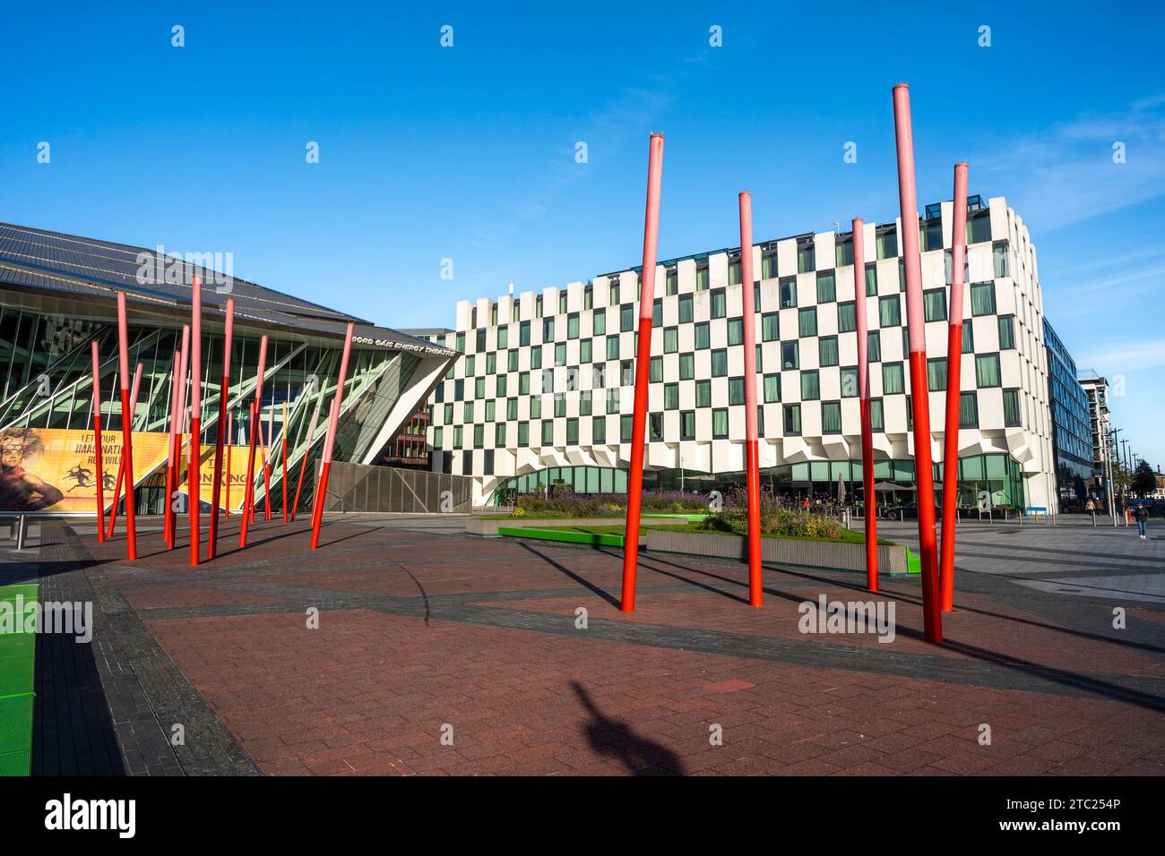 Grand Canal Square, with red resin-glass paving  with red glowing angled light sticks, in the Southside area, Dublin's Docklands, Ireland. Stock Photo