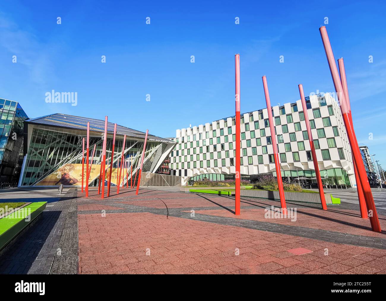 Grand Canal Square, with red resin-glass paving  with red glowing angled light sticks, in the Southside area, Dublin's Docklands, Ireland. Stock Photo