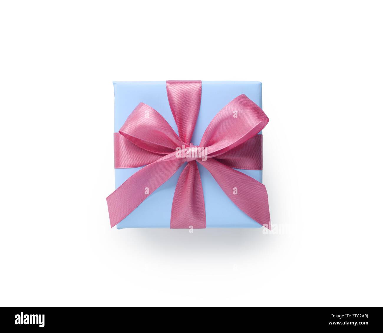 Top view of blue gift box with pink ribbon bow isolated on white background, directly above Stock Photo